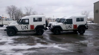 UN J8 Troop Carrier Jeeps in Parking Lot